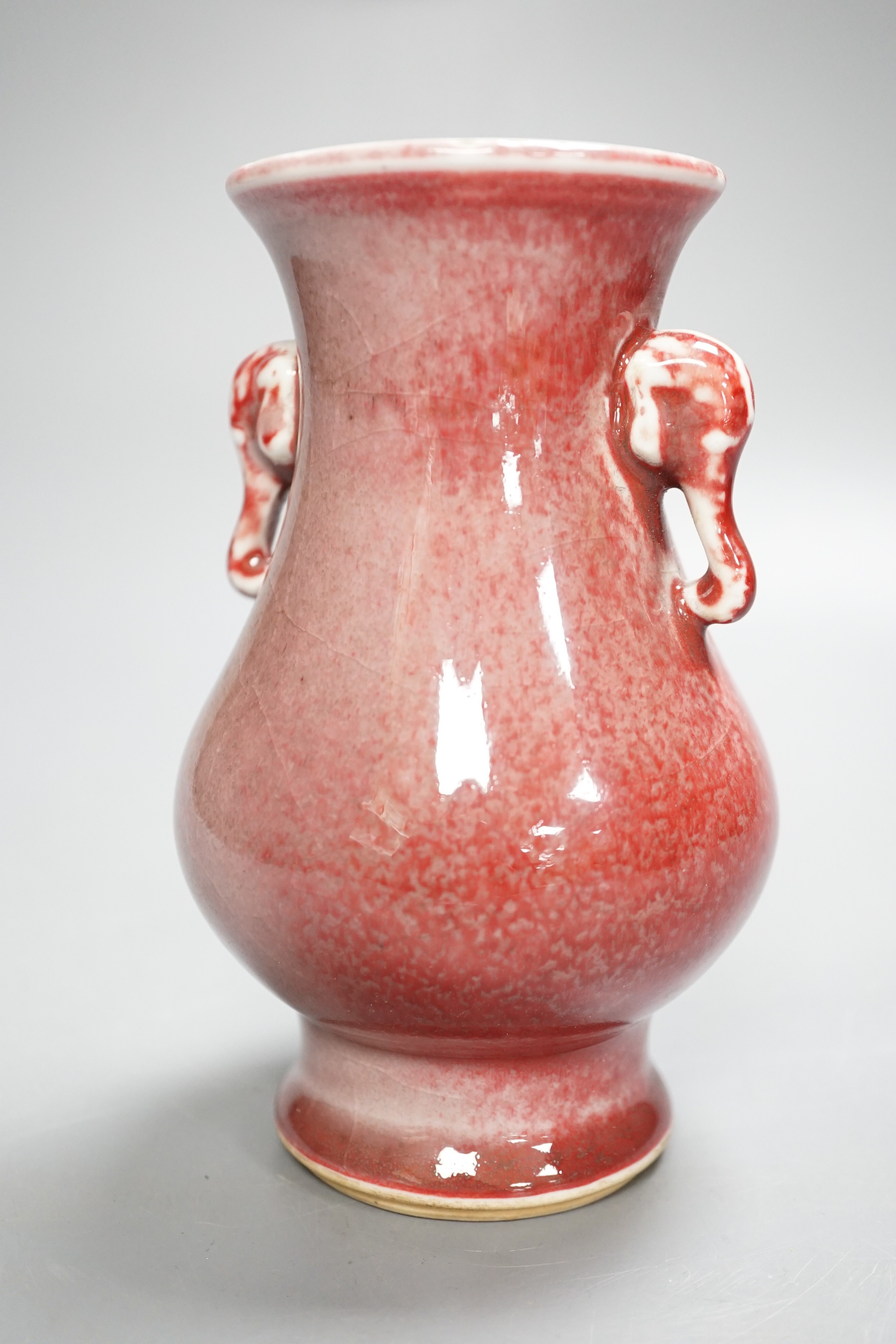 A Chinese Sang de boeuf elephant handled vase 15.5cm